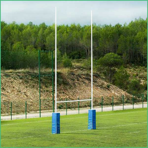 Empty stadium field with tall white goal posts