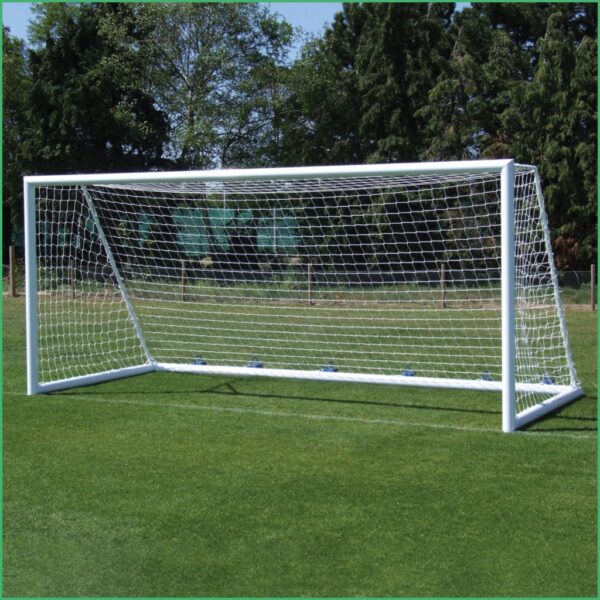 Soccer goal with white frame and net on a grassy field
