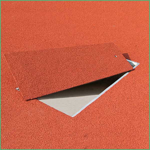 Red asphalt shingle roof with one shingle lifted, exposing grey underlayment beneath