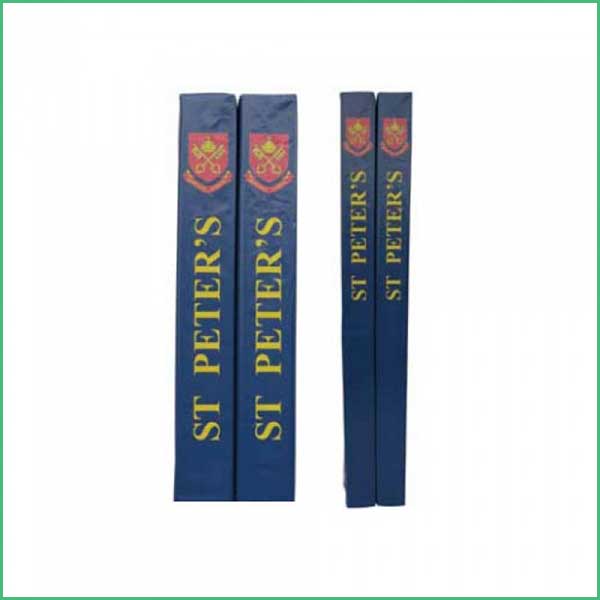 Two blue hardcover books (two larger and two smaller) standing upright; spines read ST PETER'S in yellow with a red crest above