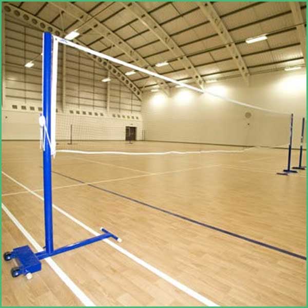 Portable volleyball net system with a tall white frame