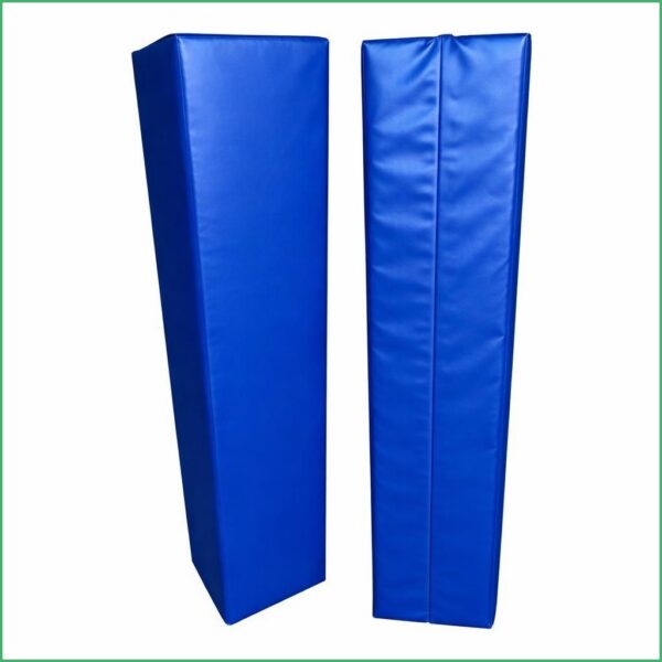 Four green padded posts with white vertical poles extending upward