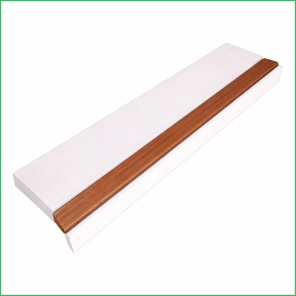 Long white baseboard trim with a narrow reddish brown wood inlay along its length