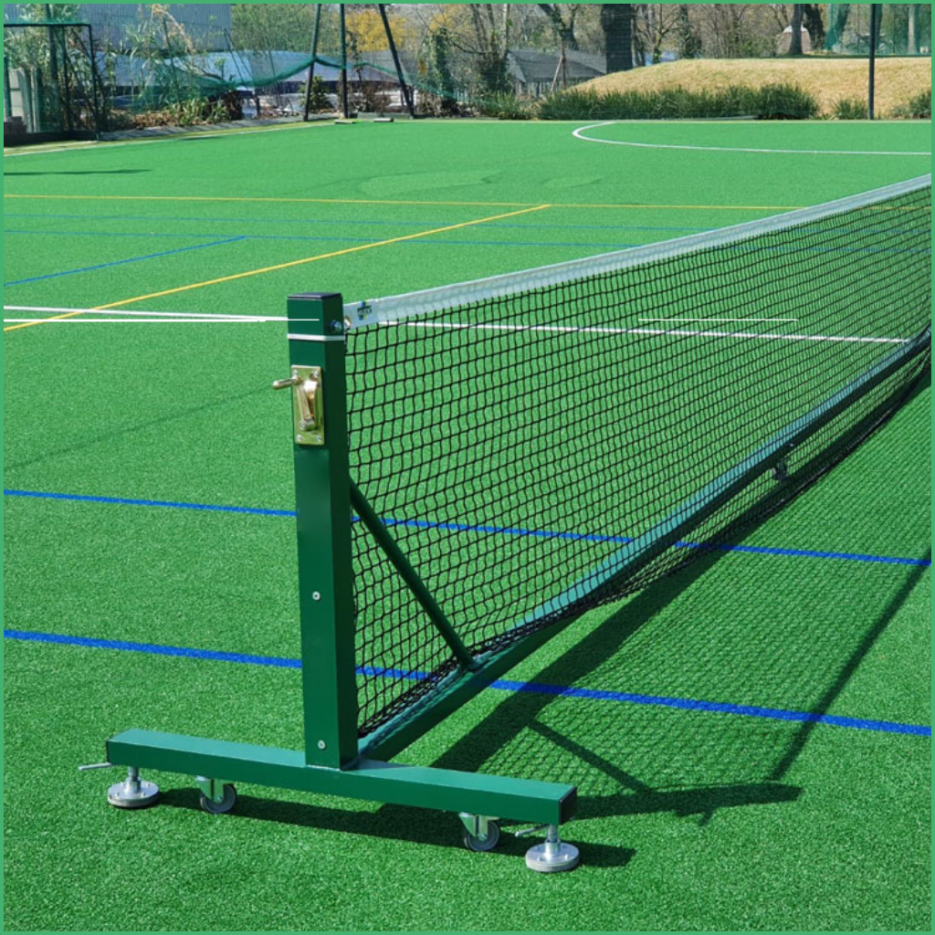 Portable tennis net on an outdoor artificial turf court with wheels and a secure base frame